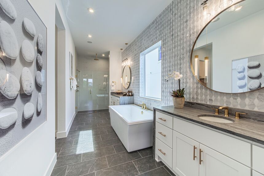 Primary bathroom with a freestanding tub and a double vanity